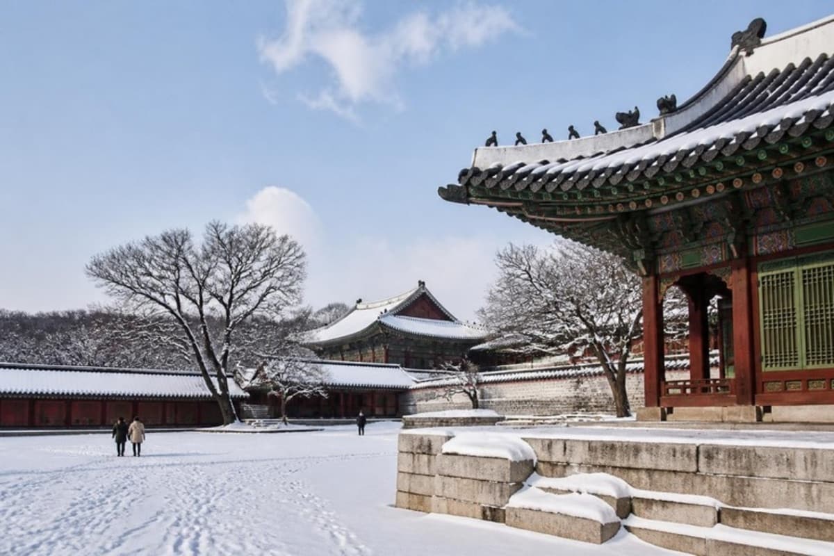 Snow on the roofs and courtyard of a traditional palace in Seoul in winter